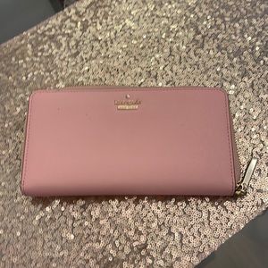 Kate Spade zipper wallet black and white stripes inside.